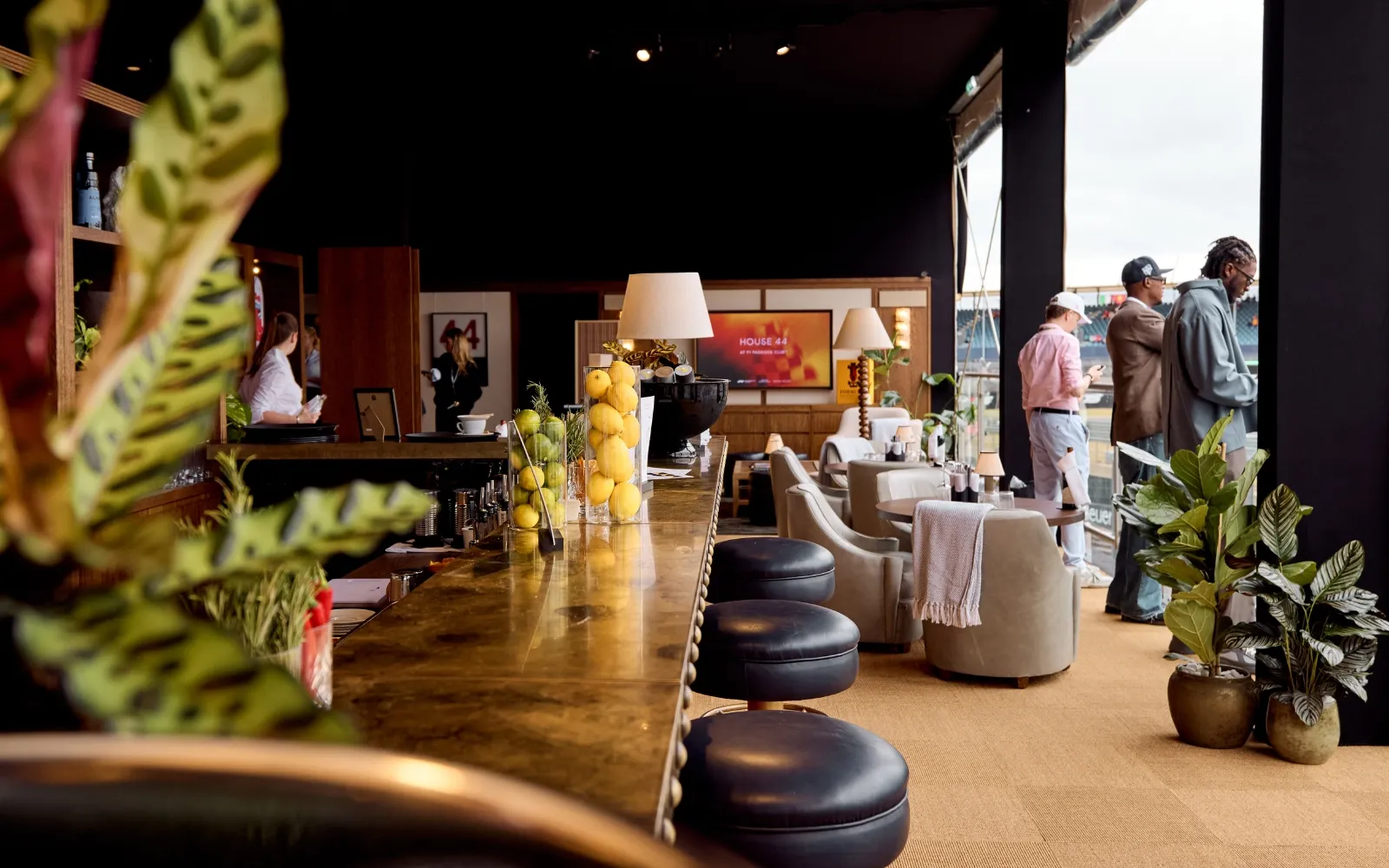 House 44 bar area inside F1 Paddock Club Hospitality with premium lounge and trackside views