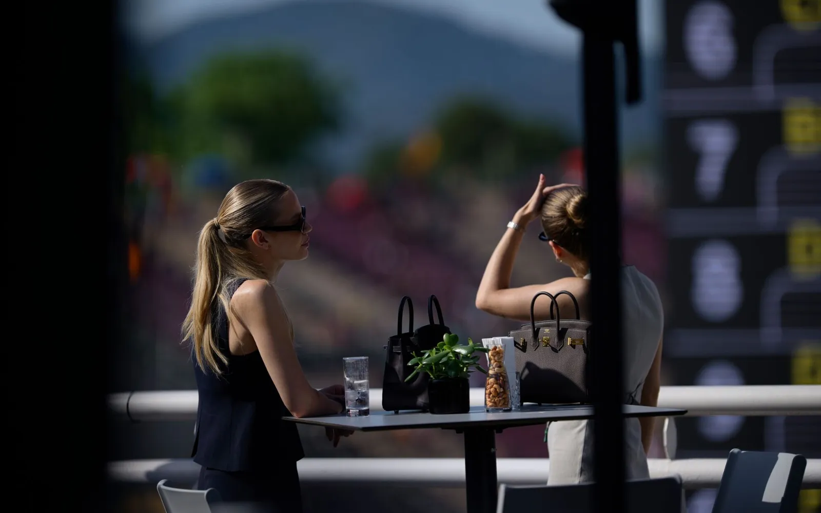 guests relaxing inside premium F1 Paddock Club hospitality suite