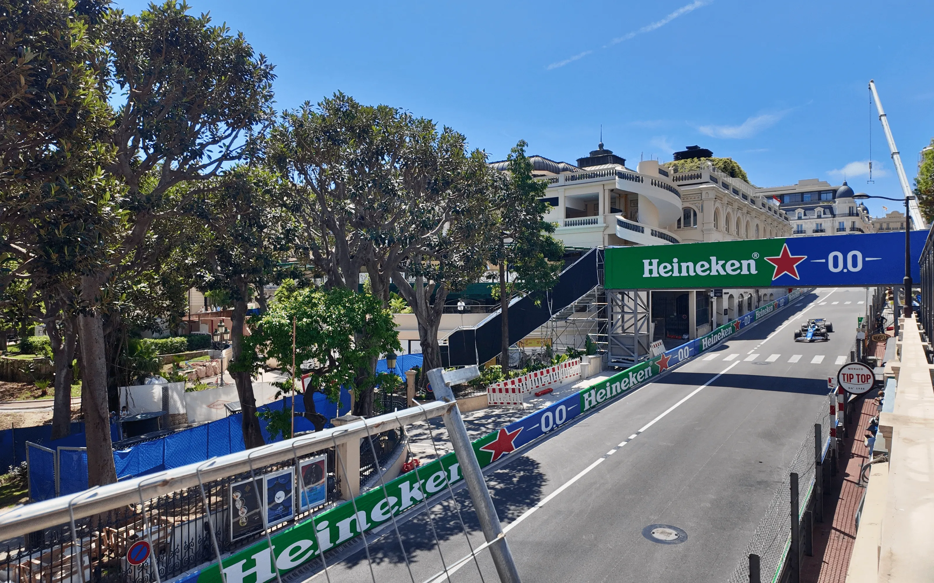 Formula 1 cars racing past spectators on the Monaco Grand Prix street circuit