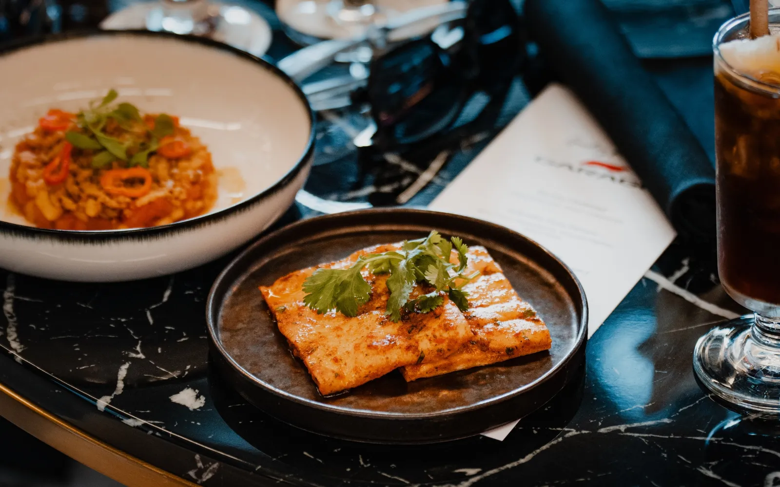 Gourmet dining at Gordon Ramsay F1 Garage featuring Michelin-level cuisine in Formula 1 hospitality suite