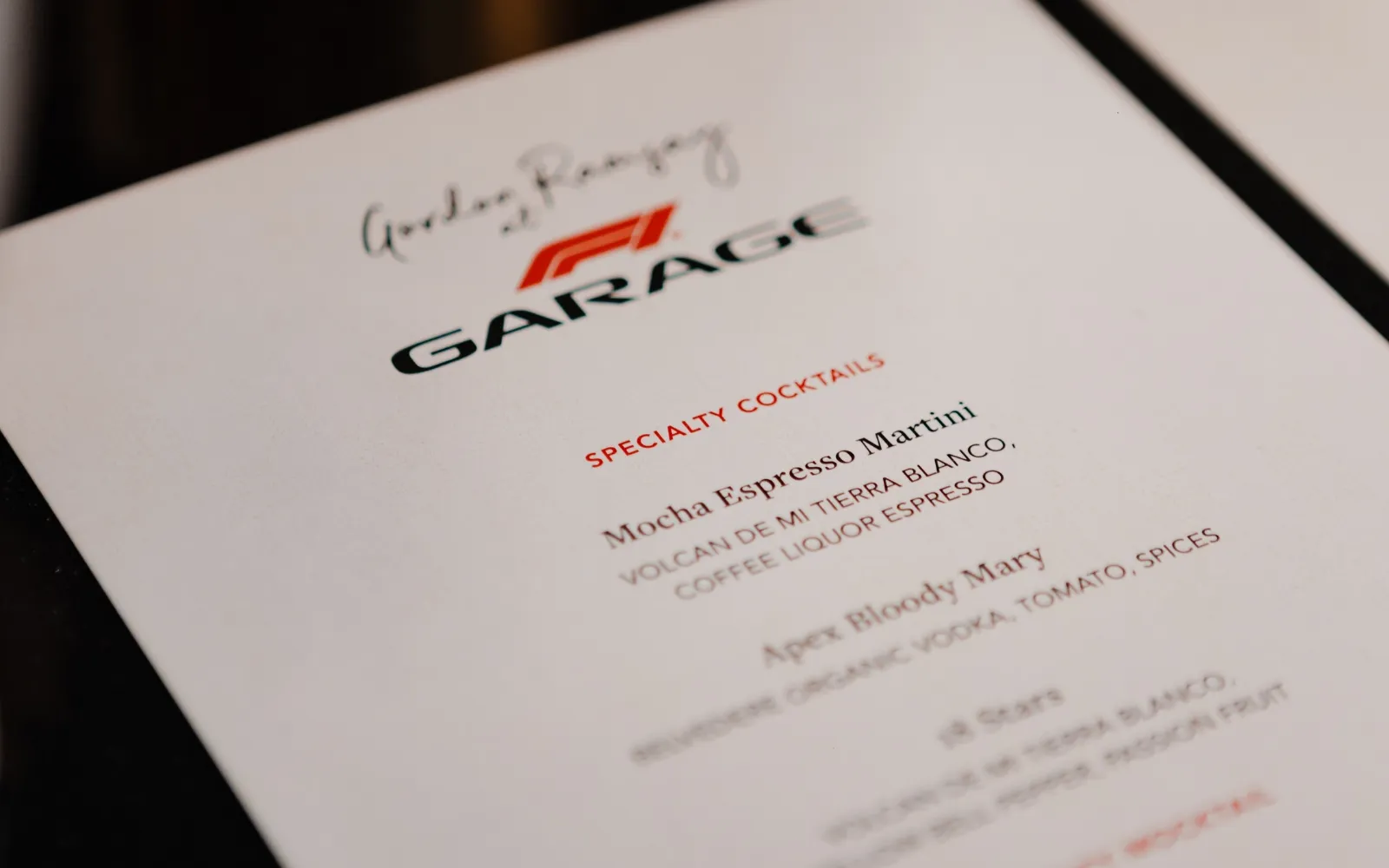 Gordon Ramsay at F1 Garage cocktail menu featuring premium drinks
