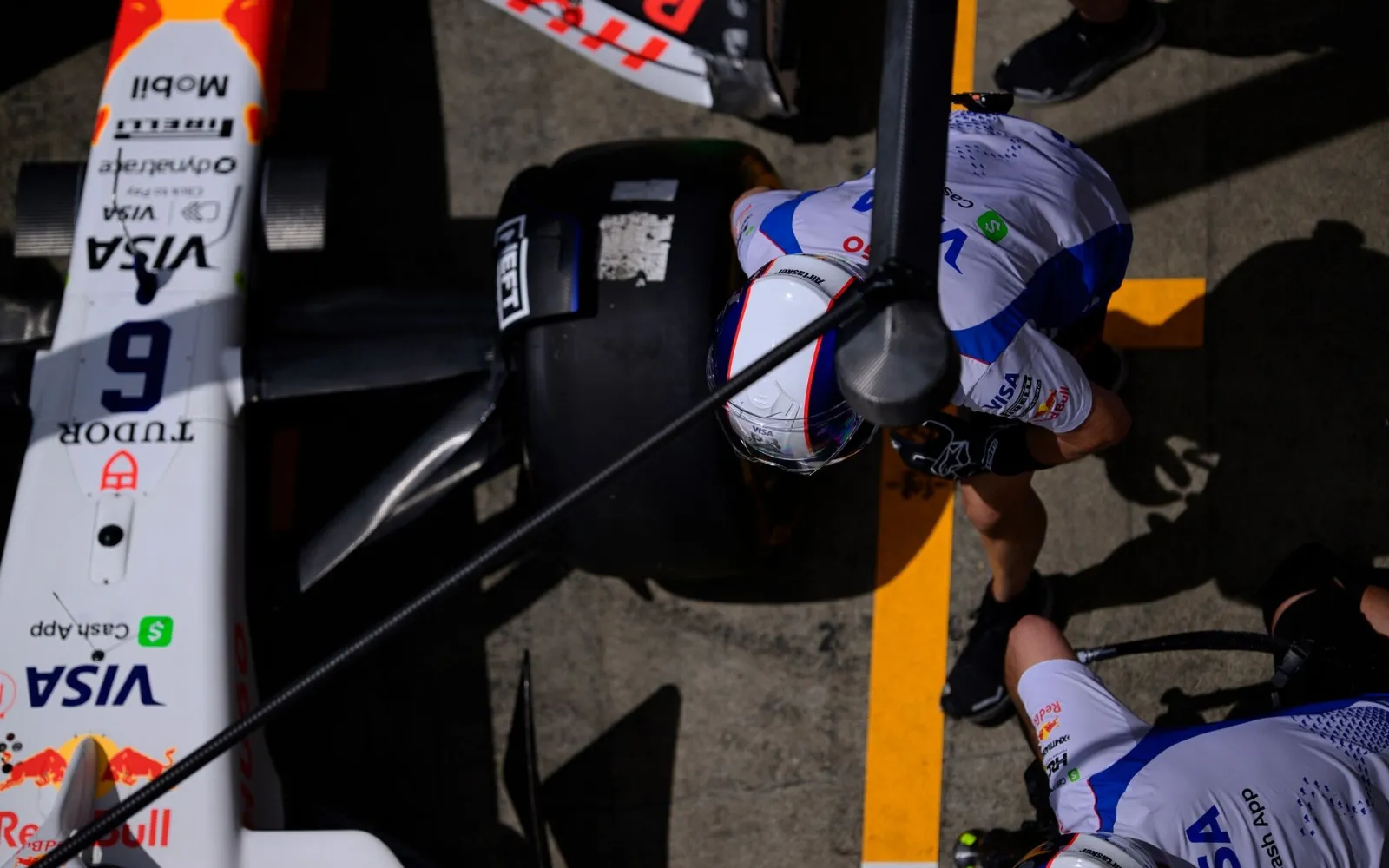Formula 1 pit crew practising pit stop viewed from F1 Paddock Club Hospitality