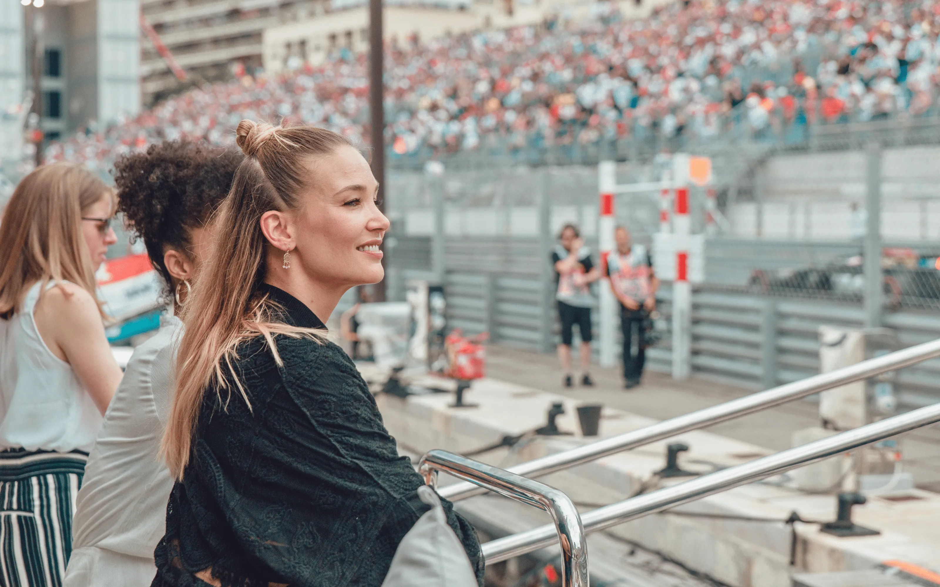 Guests enjoying trackside views from a superyacht in Monaco Harbour