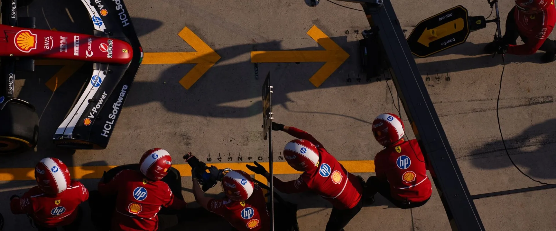 F1 Paddock Club Hospitality view of Formula 1 pit stop and team garage action