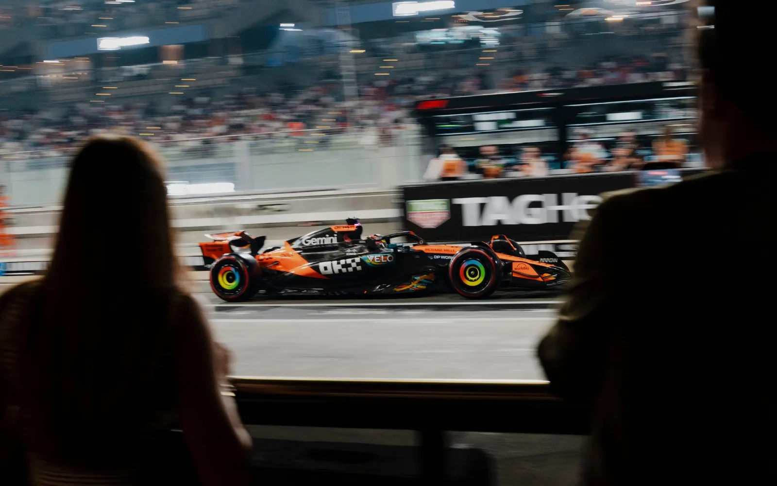 Formula 1 car passing close to spectators at F1 Paddock Club Hospitality