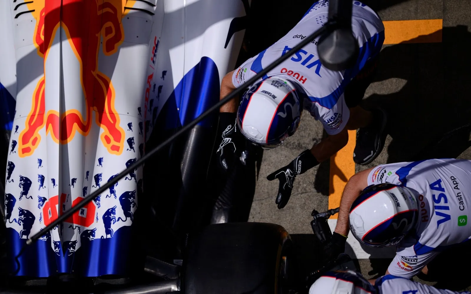Red Bull Racing pit crew preparing Formula 1 car during pit stop